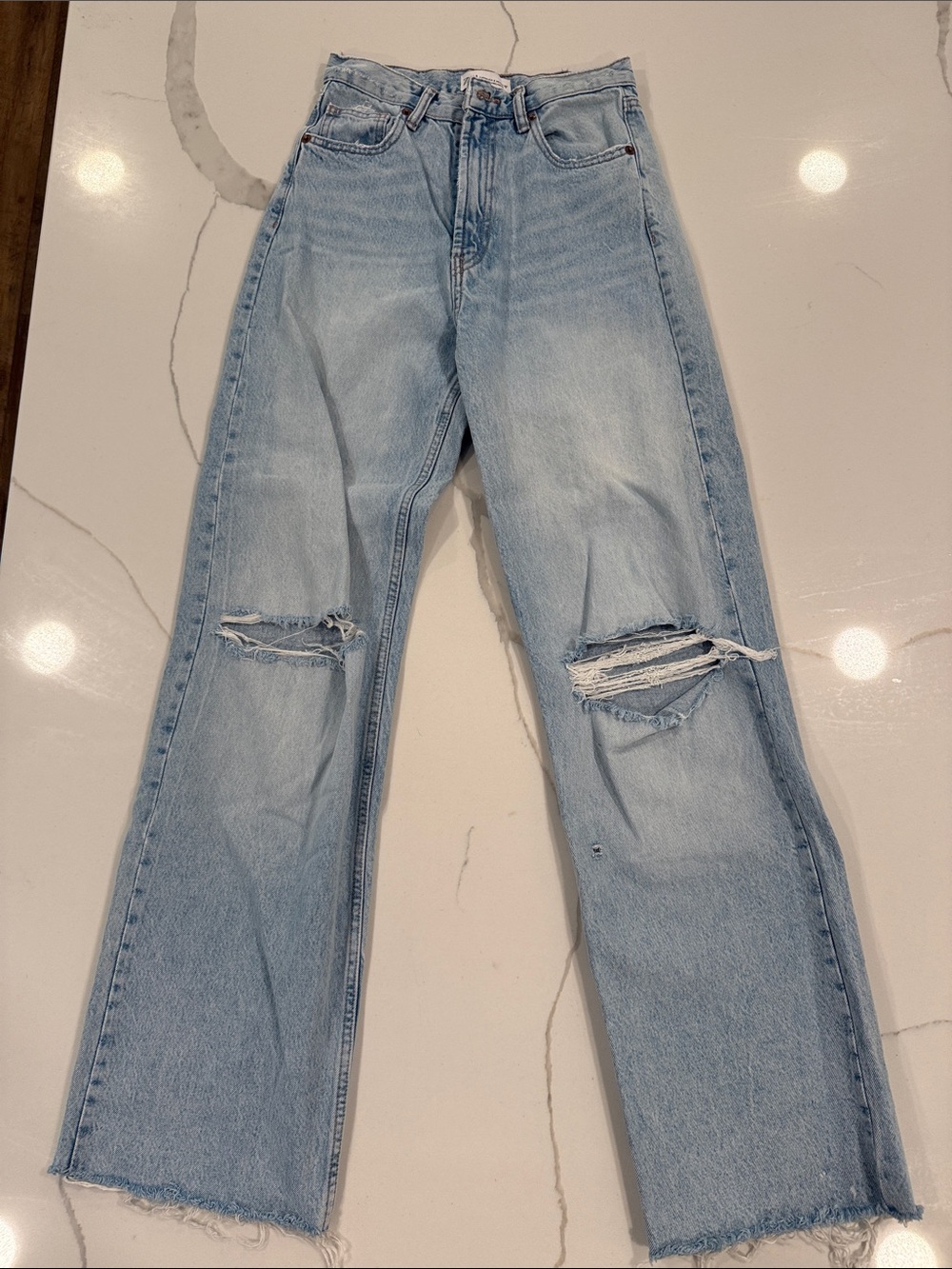 Zara Light Wash Distressed High-Rise Women's Jeans with raw hem
